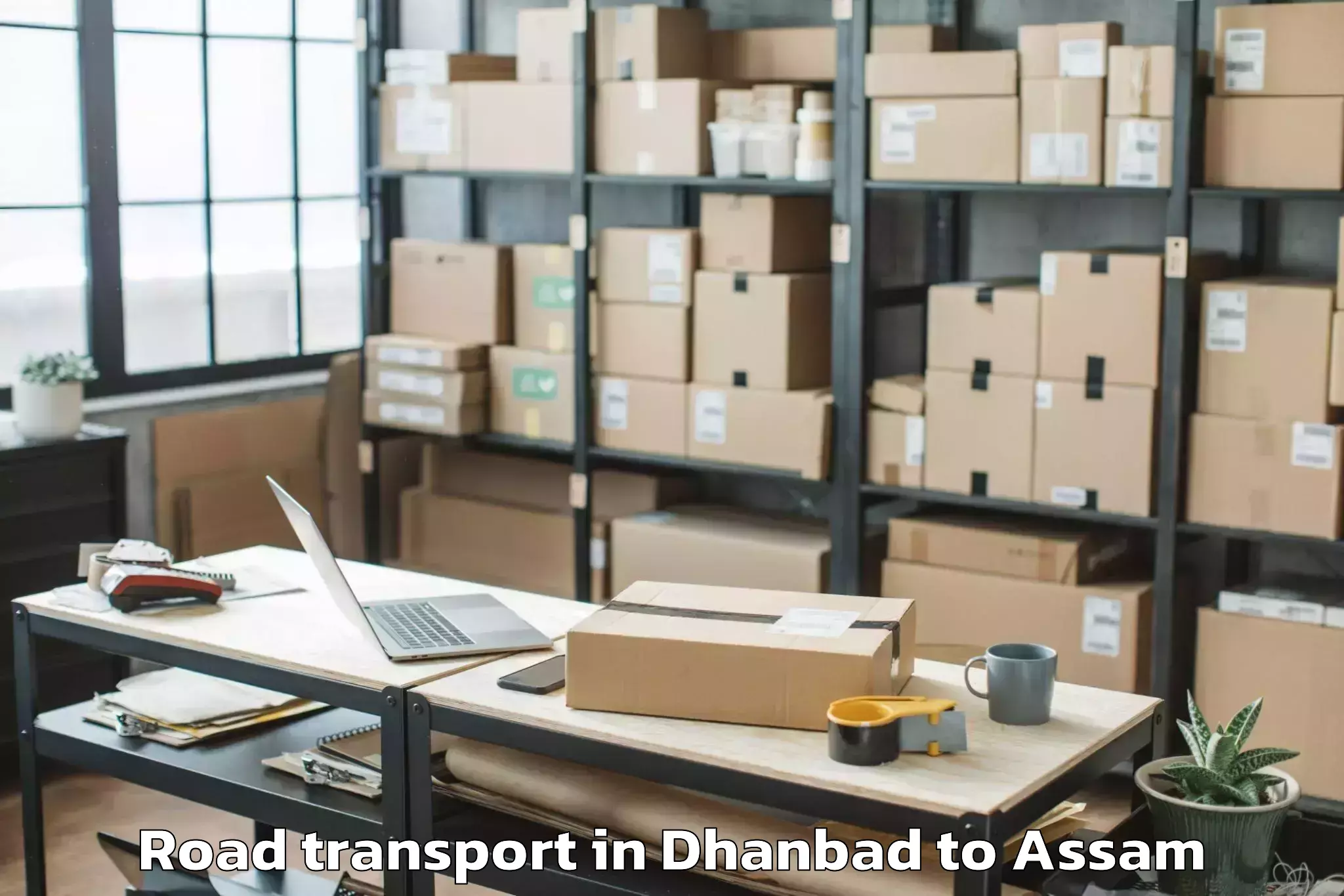 Book Dhanbad to Morigaon Road Transport Online